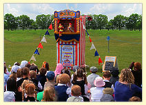 Punch & Judy show with children in front