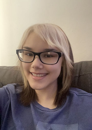 This is a picture of me. I have glasses, brown eyes, and brown hair with bleached blonde pieces in the front