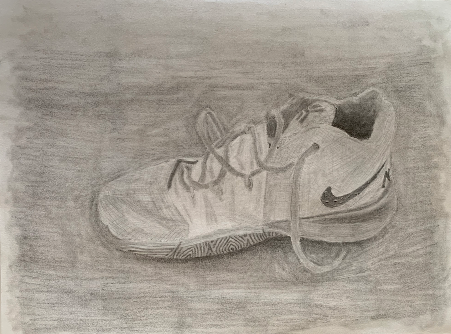 a photo of a drawing of a basketball shoe. The drawing is done with paper and pencil.